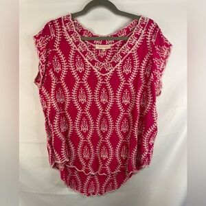 This is a hot pink blouse with loose sleeves and white embroidery. By Solitaire.